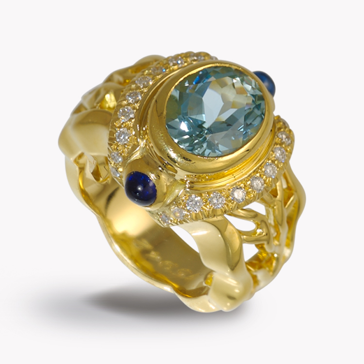 Item # 21303 double flowing lines blue topaz yellow gold ring