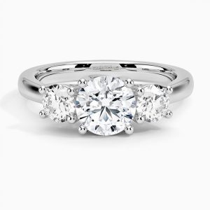 Three Stone Diamond Engagement Ring Designed & Handmade in 18kt White Gold & Platinum featuring 3 Round Brilliant cut F/SI1 Quality Diamonds weighing a total of 0.98cts with the Center Stone weighing 0.48cts